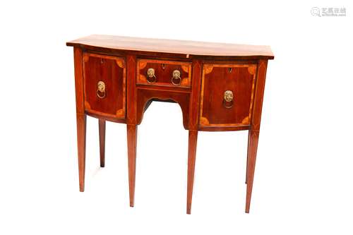 A George III Sheraton design mahogany bow fronted sideboard of small proportions