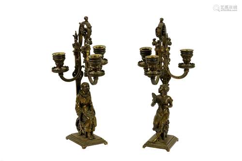 A pair of late 19th century French gilt bronze candlesticks, circa 1900