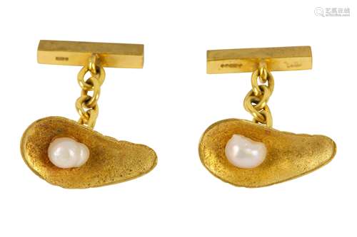 A pair of gold oyster shell cufflinks