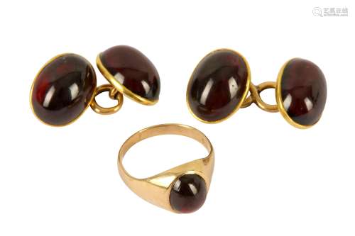 A pair of garnet cufflinks and garnet set gold ring