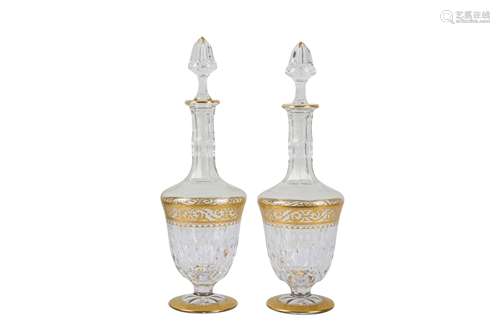 Two St Louis faceted crystal decanters with gilt highlights