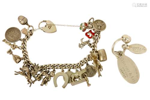 A key chain by Tiffany & Co. and silver charm bracelet