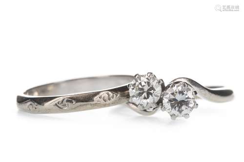 A DIAMOND TWO STONE RING AND A WEDDING BAND