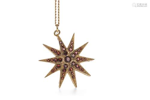 A RED GEM SET STAR PENDANT