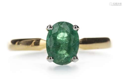 AN EMERALD SOLITAIRE RING