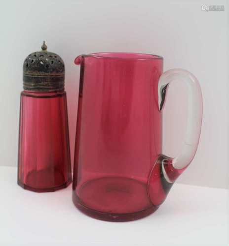 A CRANBERRY GLASS JUG, with clear glass handle, 14cm, together with A CRANBERRY GLASS SUGAR