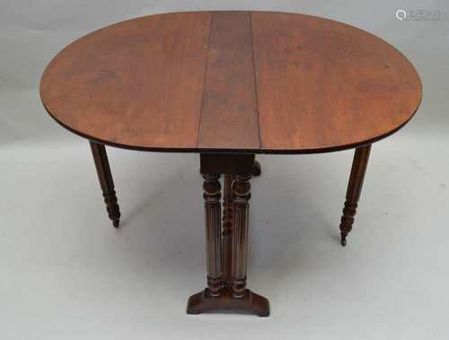 A 19TH CENTURY MAHOGANY TWIN FLAP SUTHERLAND DESIGN TABLE, supported on turned and reeded legs, with