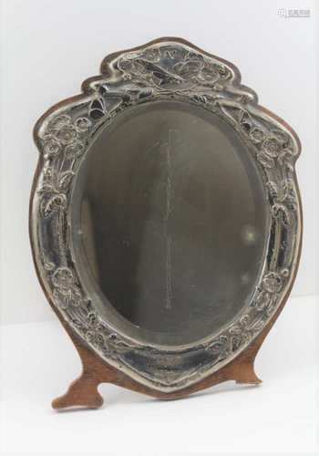 AN EDWARDIAN ART NOUVEAU DESIGN SILVER MOUNTED EASEL MIRROR, embossed floral & insect decoration,