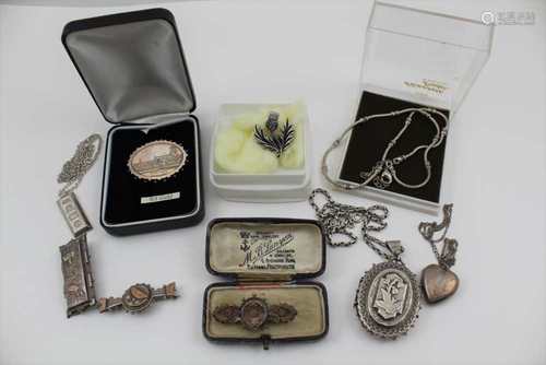 A QUANTITY OF SILVER JEWELLERY to include; a large locket pendant on chain, a silver ingot on chain,