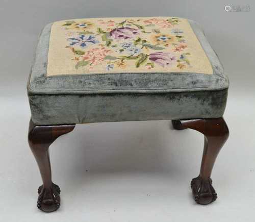 AN EARLY 20TH CENTURY WOOLWORK PAD TOP RECTANGULAR STOOL, supported on cabriole legs, with well