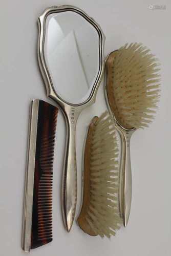 A LATE 20TH CENTURY SILVER MOUNTED FOUR PIECE DRESSING TABLE SET, comprising; hand mirror, two