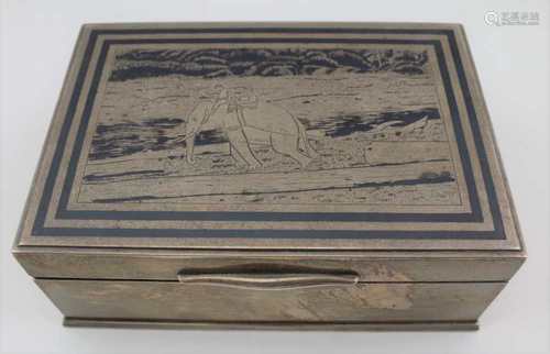 A SOUTH EAST ASIAN STERLING SILVER CIGARETTE BOX, the hinged cover having a Niello work logging