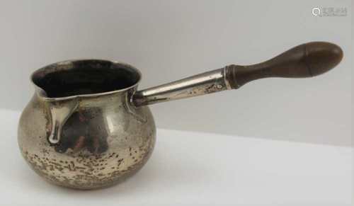 A GEORGE III SILVER BRANDY SAUCEPAN of squat form, with flared rim and pouring lip, turned wood