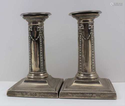 THOMAS BRADBURY & SONS A PAIR OF LATE 19TH CENTURY SILVER CANDLESTICKS, the cylindrical stems