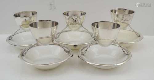 A SET OF FIVE CHRISTOPHER DRESSER DESIGN EGGCUPS, the plated frame stamped for 