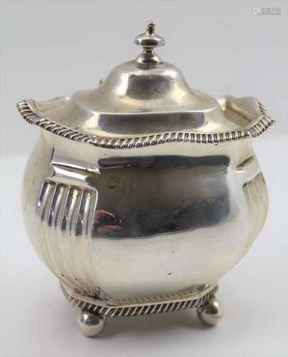 CHARLES STUART HARRIS AN EDWARDIAN SILVER LIDDED SUGAR BOX of Georgian design, lobed form with