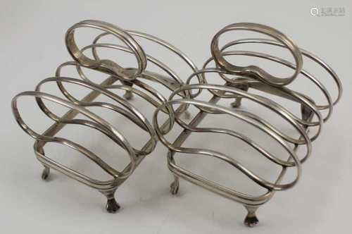 ASPREY & CO. LTD A PAIR OF SILVER TOAST RACKS, squat form, raised on trefid feet, Sheffield 1927 and