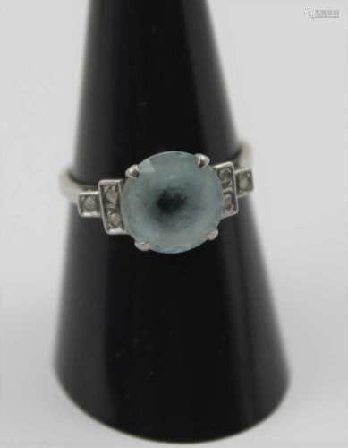 A SOLITAIRE AQUAMARINE RING, set six diamonds to the shoulder mount, considered to be white gold,