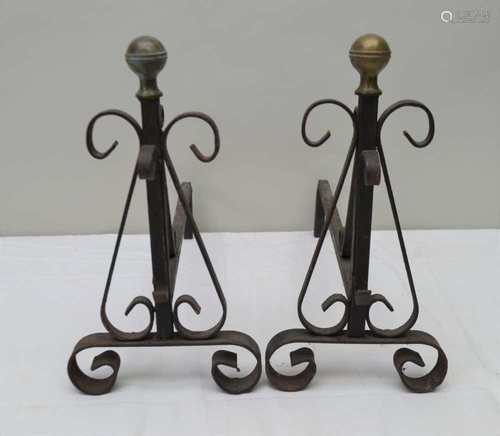 A PAIR OF METAL FIRE DOGS with spherical brass knop tops, 33cm high