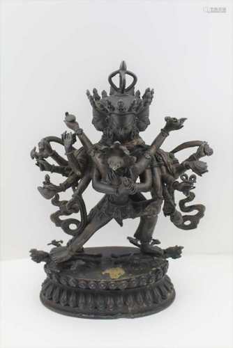 A BRONZE YAB-YUM OF TIBETAN FORM, depicts Sitasamvara and his Sakti, his many arms holding