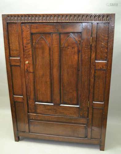 A PART 18TH / 19TH CENTURY TIMBER CONSTRUCTED HALL ROBE, with later adaptations, having a carved