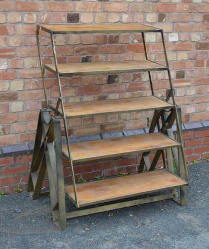 A SET OF INDUSTRIAL CHIC METAL FRAMED ADJUSTABLE SHELVES, with wooden inserts, the whole being