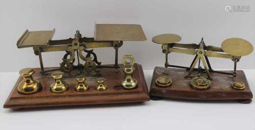 A BRASS LETTER SCALE on mahogany base, 24cm wide, the platform is engraved with postal rates,