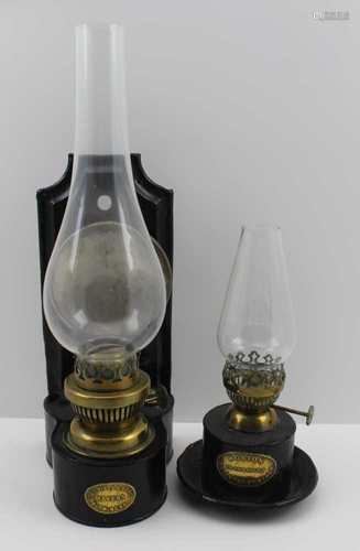 A TIN PLATE AND BRASS WALL MOUNTING OIL LAMP by 