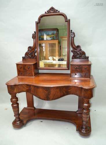 A LATE 19TH CENTURY MAHOGANY FINISHED DRESSING TABLE, having central adjustable plain plate,