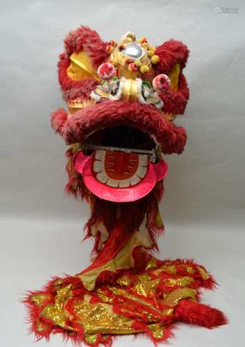 A CHINESE DANCING DRAGON COSTUME, having large painted head, with articulated mouth, the body