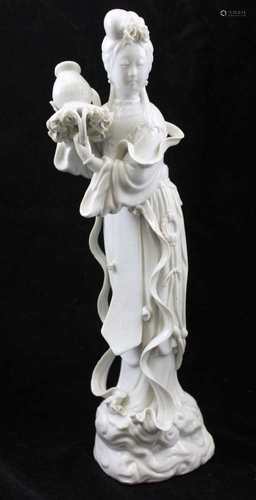 A 20TH CENTURY CHINESE PORCELAIN BLANC DE CHINE FIGURE GUANYIN, standing on a cloud base, 37.5cm