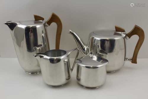 A FOUR PIECE PICQUOT WARE TEA SET, aluminium body with polished wood handles, comprising; tea pot,