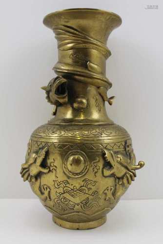 A JAPANESE BRASS VASE, chased and cast decoration to include dragons chasing and competing for the