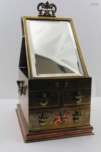 A 20TH CENTURY CHASED BRASS CHINESE JEWELLERY BOX with fold out mirror top, over two inline