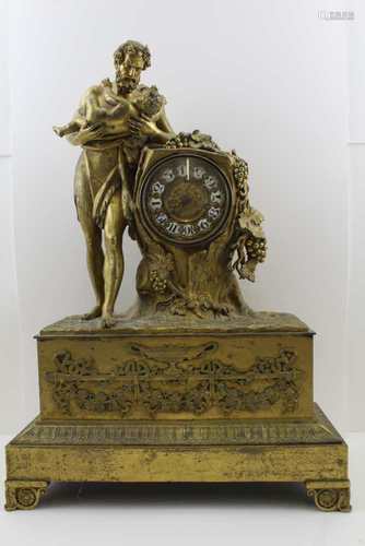 A 19TH CENTURY FRENCH ORMOLU MANTEL CLOCK, cast case with Bacchus cradling an infant whilst