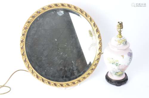 A gilt circular mirror, 44cm, together with a contemporary Chinese chrysanthemum lamp, sold for