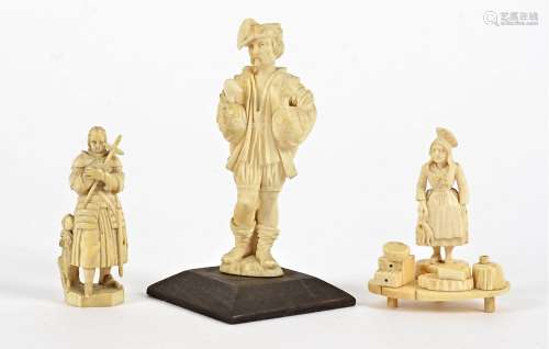 A group of European ivory and bone studies, one a goose fair figure mounted upon a wooden base,