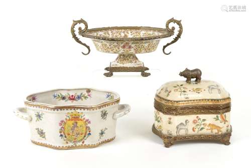 Two contemporary ceramic centrepieces, including an example on a four footed metal base, decorated
