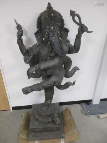 A large copper garden statue of the Hindu deity Ganesh, raised on a square plinth with elephants and