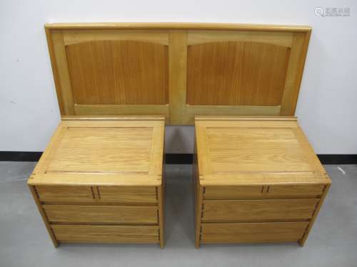 Two Cotswold School style bedside cabinets, oak frames with panelled sides and tops, mahogany drawer
