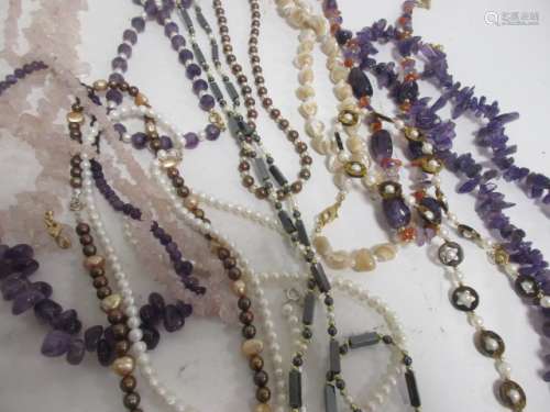 Several hardstone and seed pearl necklaces, to include rose quartz and amethyst examples (12)
