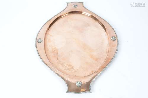 An early 20th Century twin handled oval hammered copper and white metal tray, with impressed '