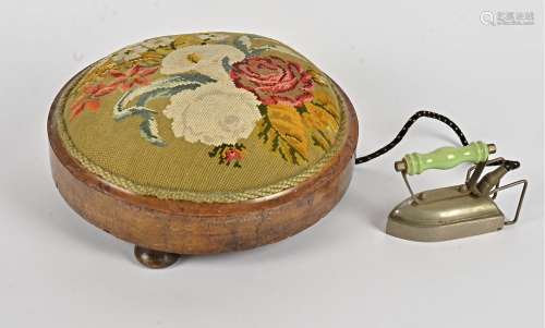 A 20th Century footstool, embroidered with flowers upon a green ground, together with a 1950's