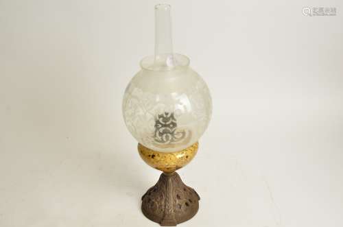 An English cast iron and glass oil lamp, height without shade 23cm