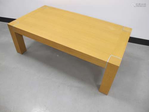 A contemporary oak veneered rectangular coffee table