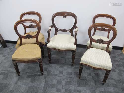 A set of four 19th century mahogany balloon backed dinning side chairs, back rails having a