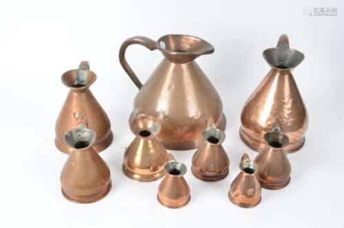 A group of graduated Victorian and later copper jugs, 1/2 gallon, quart, gill, 1/2 pint (9)