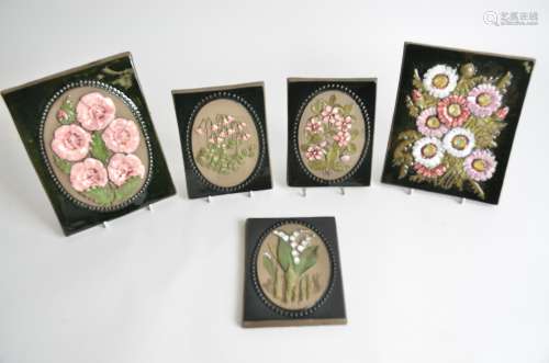 Five Swedish pottery wall plaques by Jie Gantofta, all with raised floral designs, largest 23cm x