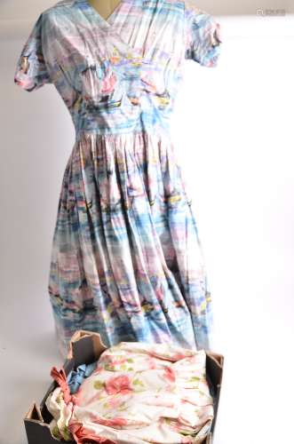 Three 1950's era vintage dresses, a rose print dress by Horrockses, a boat print dress with a