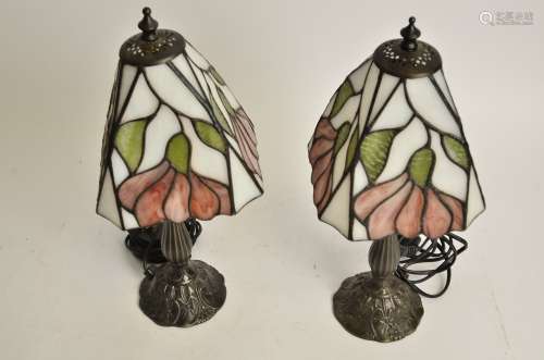 A pair of contemporary Tiffany style stained glass topped table light bases, rising from organic